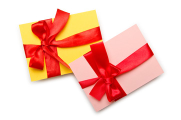 Envelope with colourful ribbon on white