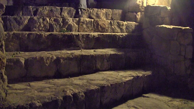 Young man walking up at stairs