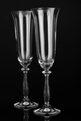 empty glasses for champagne isolated on black