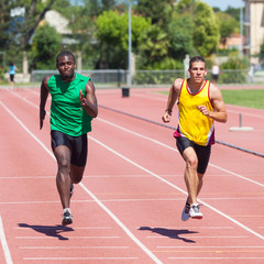 Obraz premium Two Track and Field Athletes Running