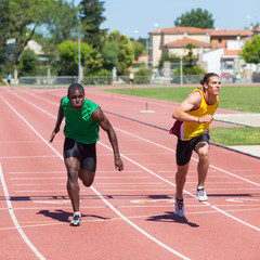 Two Track and Field Athletes Running