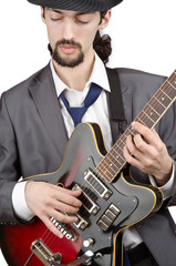 Guitar player in business suit on white