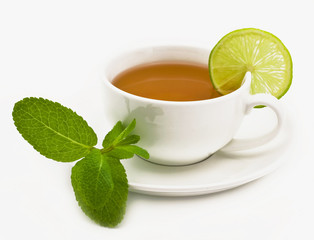 Bright tea in a white cup on a white background