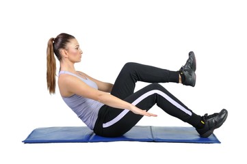 Fototapeta premium Fit young female pilates instructor showing different exercises