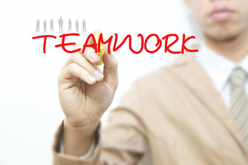 Young business man writing business word on the transparent scre