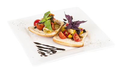 juicy tomatoes on fresh bread, pesto as topping