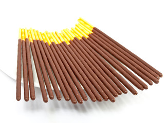 Chocolate sticks on a saucer