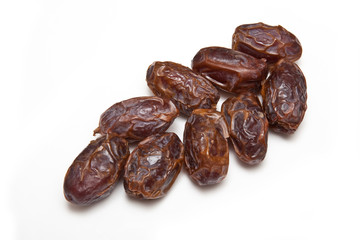 Medjool dates isolated on a white studio background.