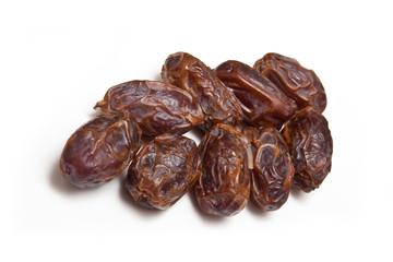 Medjool dates isolated on a white studio background.