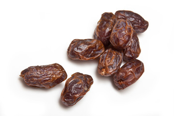 Medjool dates isolated on a white studio background.