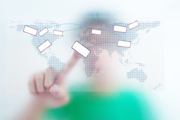 Businessman point finger on email world map