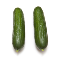 Mini Cucumbers isolated on a white studio background.