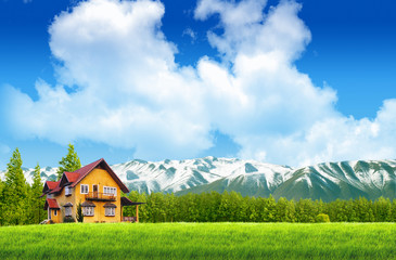 Moutain on green field landscape with blue sky