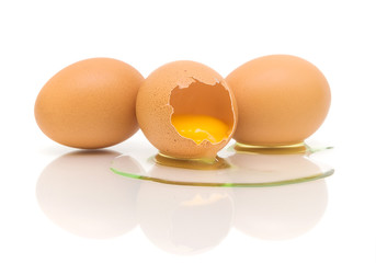 three chicken eggs on white background