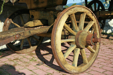 wheel of an old wooden cart for transporting things from the cit