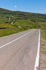 Fototapeta na wymiar Tuscan view with local curve road