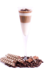 Tasty dessert with coffee beans and cinnamon