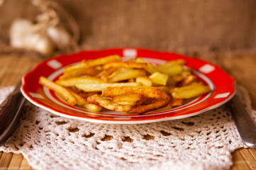 Fried potatoes with green peas