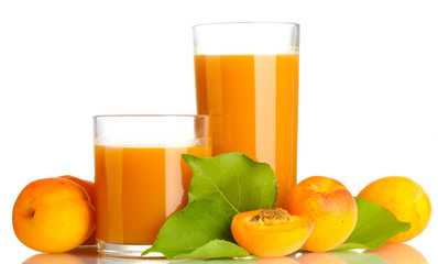 two glasses of apricot juice and apricots with leaves isolated