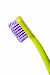 Colored toothbrush isolated on white background