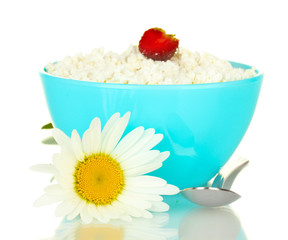 cottage cheese with strawberry in blue bowl and flowers