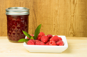 Red raspberries mint and jam or jelly