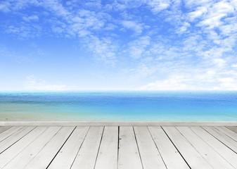 Wooden terrace looking out over a tropical cloud sky and seaview