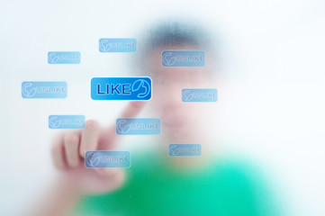 finger pressing Social Network icon on like button