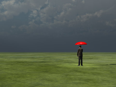 Man with red umbrella under gathering storm