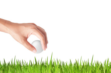 Close-up of hand holding golf ball with green grass for web desi