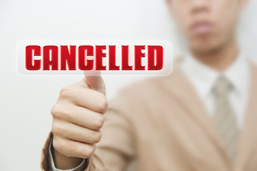 Business man pressing touch screen oncancelled button