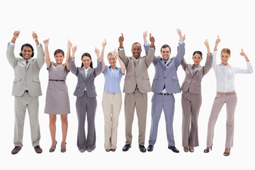Fototapeta na wymiar Business team raising their arms with the thumbs up