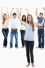 Obraz premium People in jeans with their arms raised