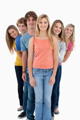 Obraz premium Full length shot of a smiling group standing behind one another
