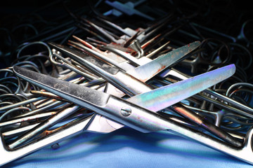 Row of used metal surgical instruments