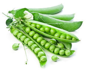 Pods of green peas with leaves