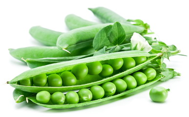Pods of green peas with leaves