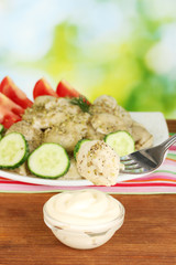 delicious dumpling dipped in sauce close-up