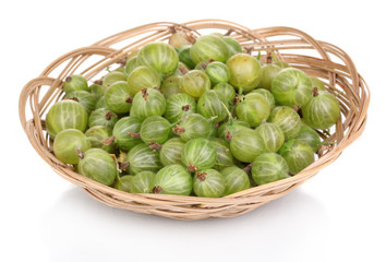 Green gooseberry in basket isolated on white