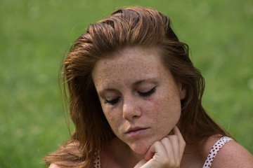 Fototapeta premium Beautiful red hair girl in a campus