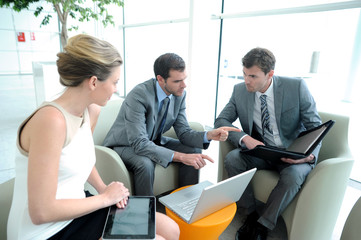 Business people meeting in trade fair building hall