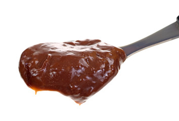 Full spoon of chocolate pudding