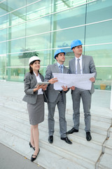 Business people checking construction site