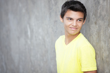 Teenager smiling over his shoulder