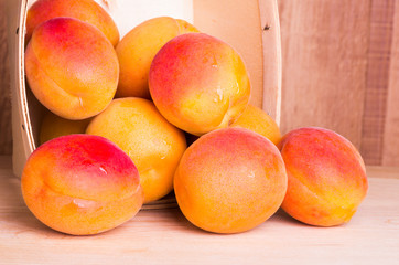 Fresh apricots in wooden basket