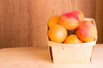 Fresh apricots in basket