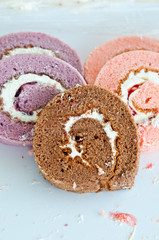 swiss roll -strawberry , taro and chocolate