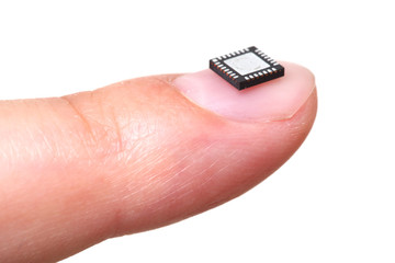 Computer microchip on girls fingernail