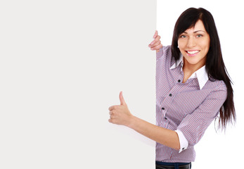 A smiling girl with a blank and showing ok