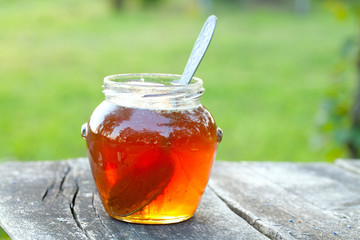 honey jar on wooden table